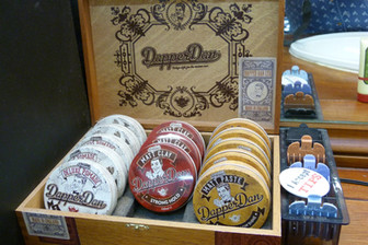 Dapper Dan grooming product tins on the shelf