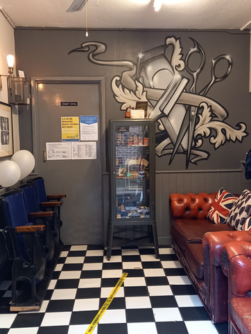 Interior doorway, wall art and checkered floor