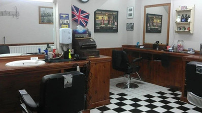 Wider view of the barber stations and vintage decor
